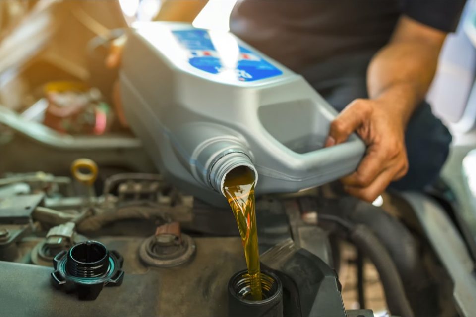 pouring oil into engine