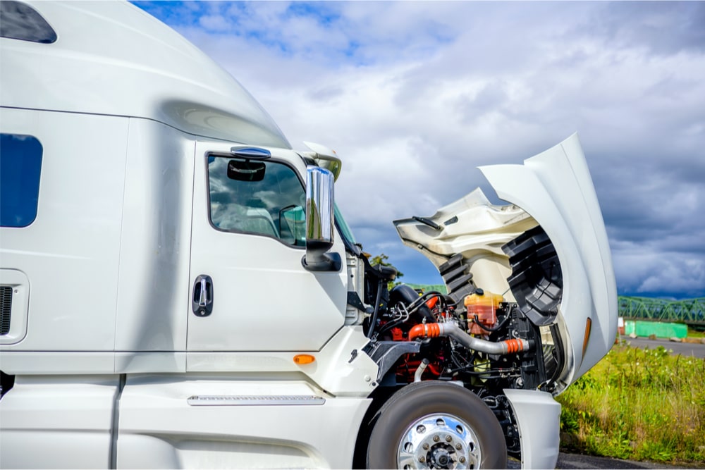 semi truck with the hood open showcasing the engine