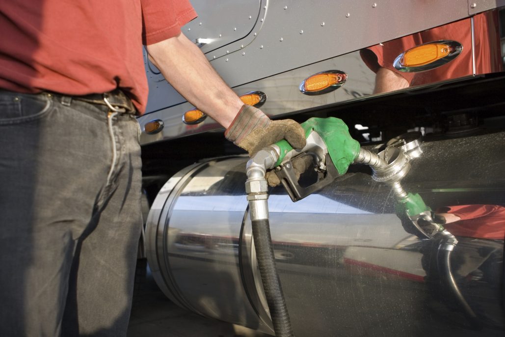 trucker pumping fuel