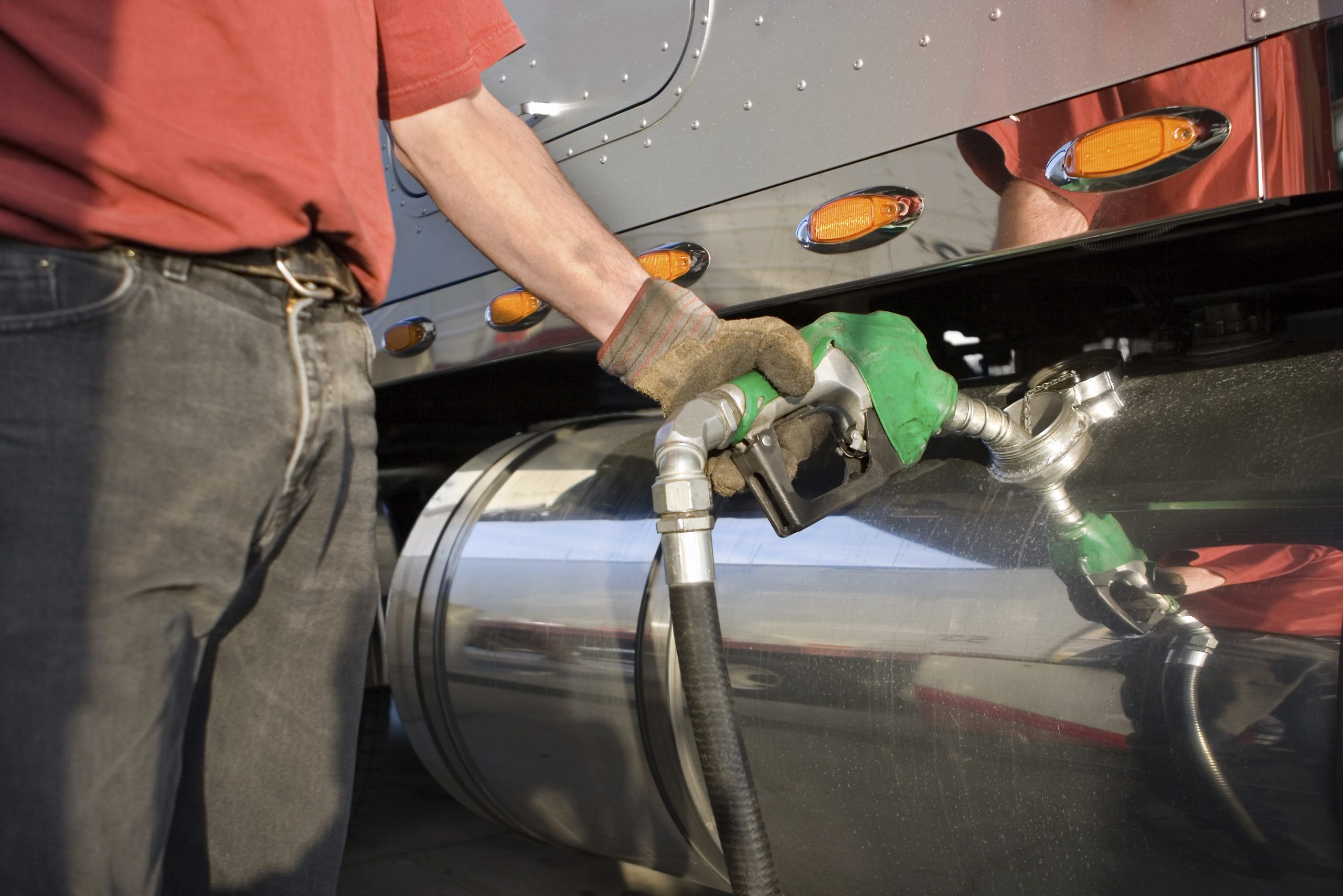 trucker pumping fuel