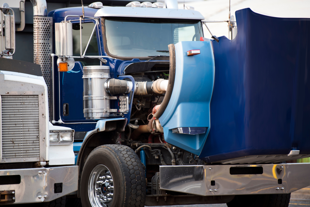 semi-truck rig with the hood up