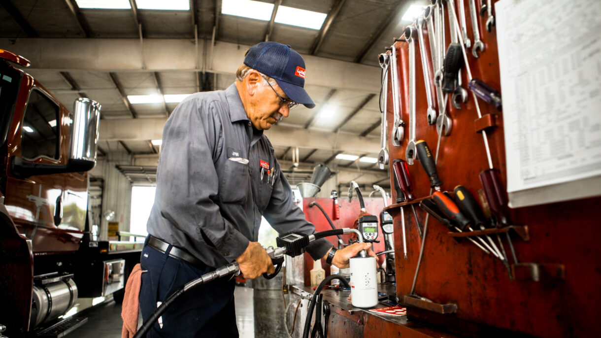 mechanic servicing a truck in a repair shop