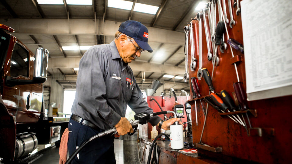 mechanic servicing a truck in a repair shop